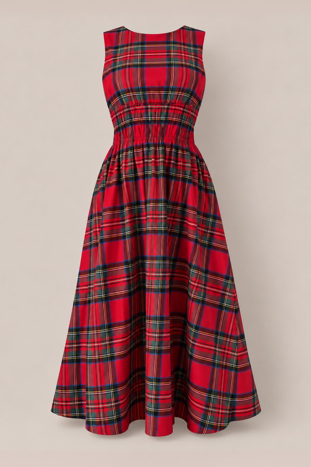 The Carly Dress in Holiday Plaid by Ivy City Co is a sleeveless, red plaid midi dress with a fitted, gathered waist and flared skirt—maternity friendly and perfect for Christmas—shown on a plain beige background.