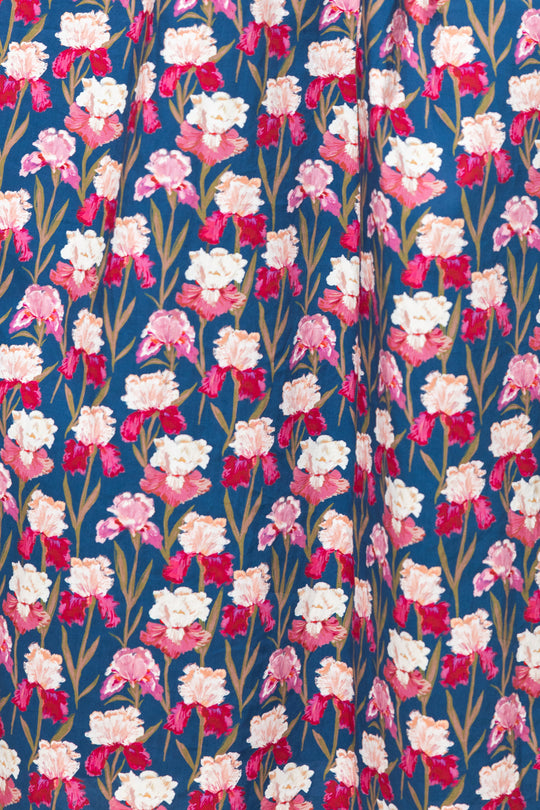 Floral pattern with pink and white flowers on a blue background