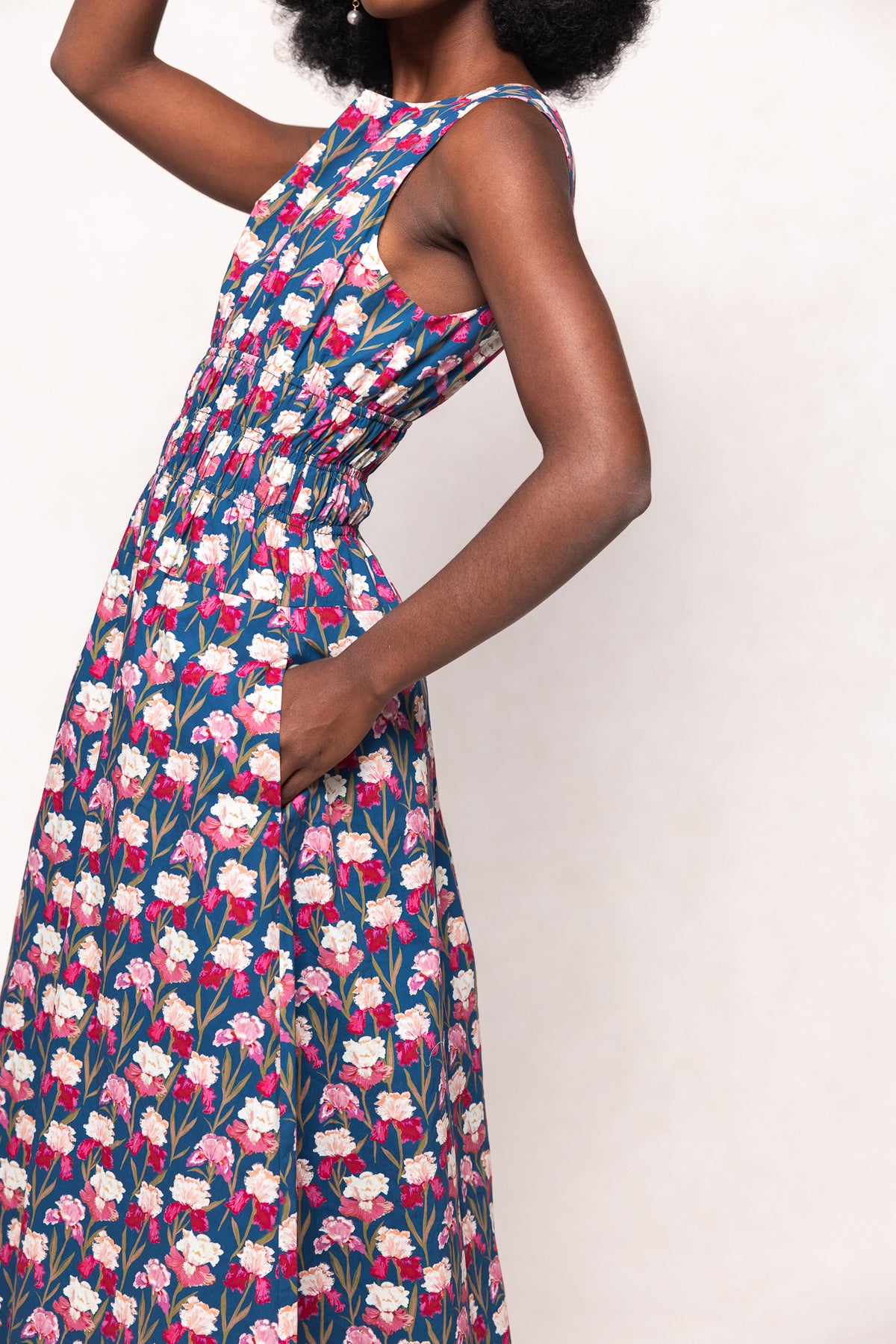 Woman wearing a floral dress on a white background