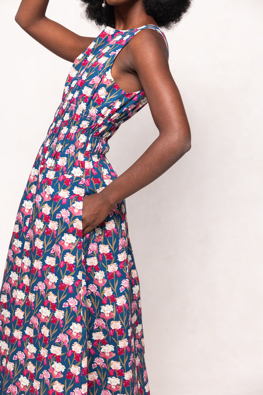 Woman wearing a floral dress on a white background