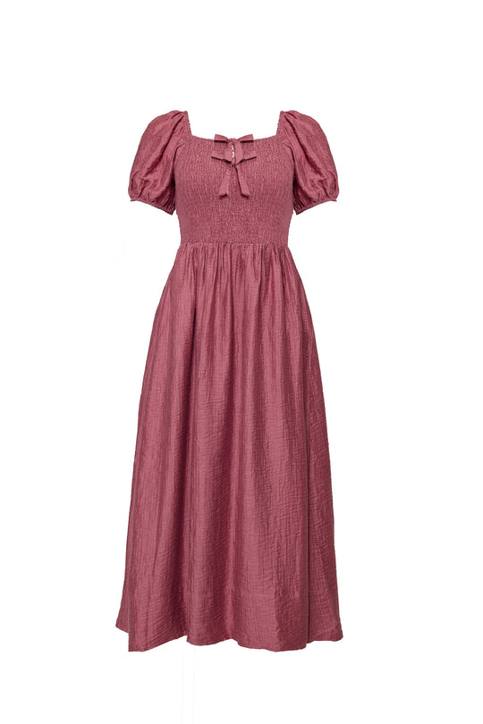 Pink dress with puff sleeves on a white background