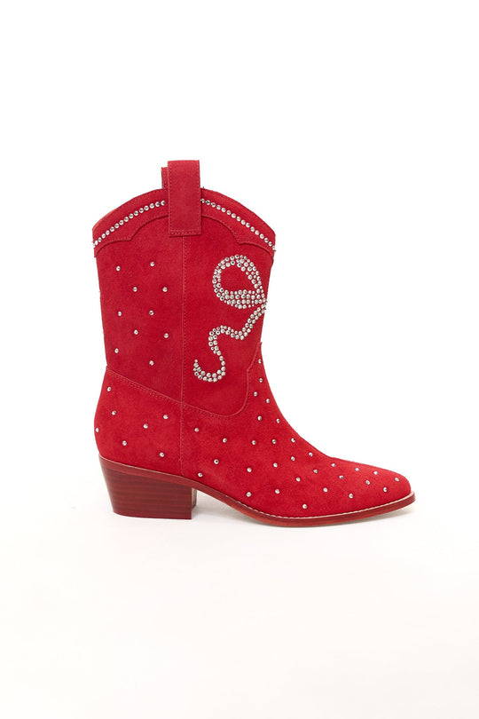 Step out in style with the Channing Bootie in Red by Ivy City Co—a pair of red suede cowboy booties featuring a low wooden heel, dazzling silver studs, and swirling rhinestone detailing. These western-inspired sparkly booties are the ultimate statement shoe.