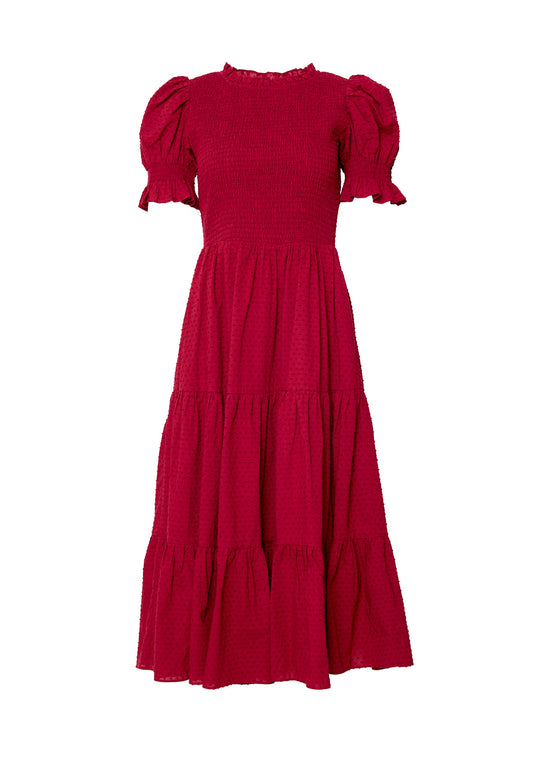 Red dress in front of a white background