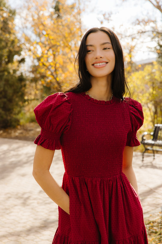 Woman in red dress outside
