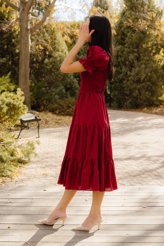 Woman in red dress outside