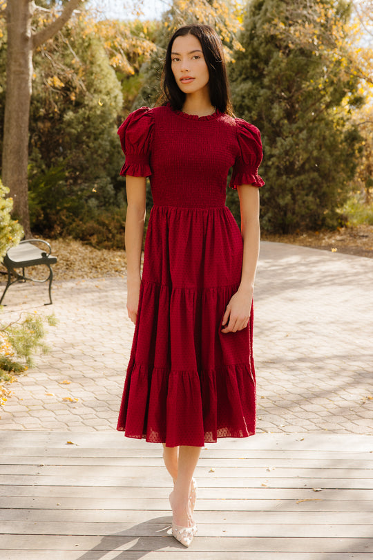 Woman in red dress outside