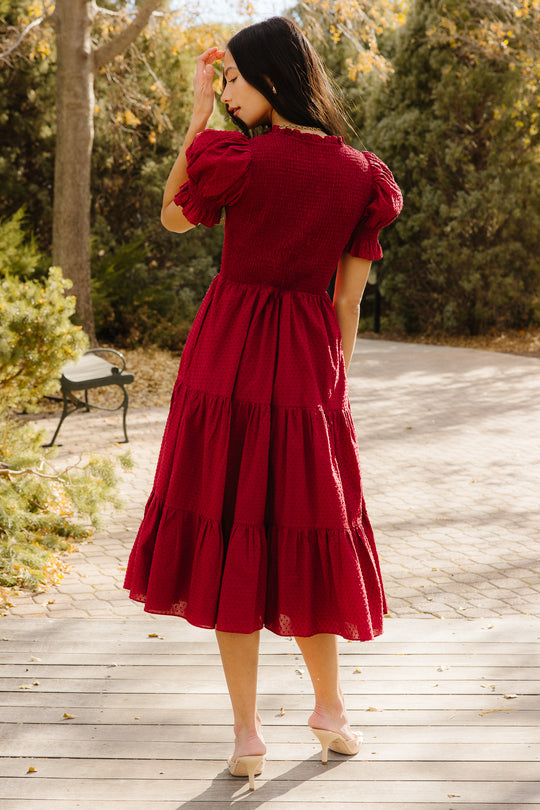Woman in red dress outside