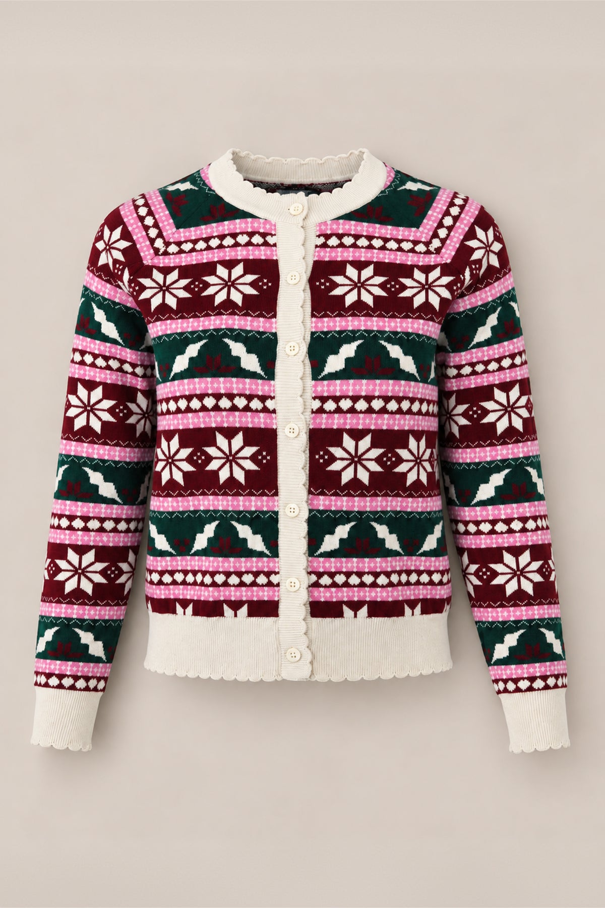 Introducing the Cornelia Cardigan in Festive Fair Isle by Ivy City Co—a cozy cotton sweater featuring a geometric and snowflake pattern in burgundy, pink, white, and green. With cream-colored buttons and trim, this maternity- and nursing-friendly cardigan brings effortless comfort and style to your seasonal wardrobe.