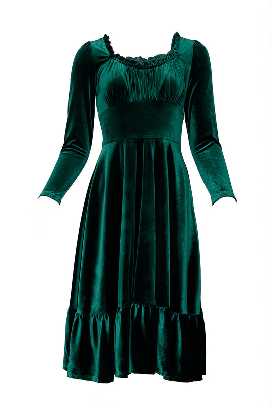 Green velvet dress against a white background