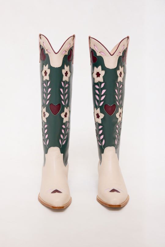 Pair of tall boots with floral design on a white background