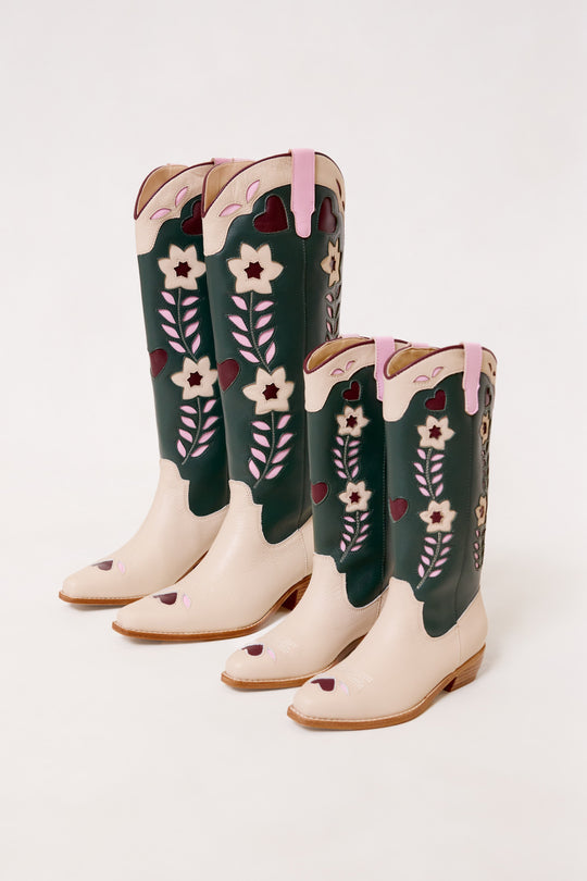 Pair of floral-patterned cowboy boots on a white background