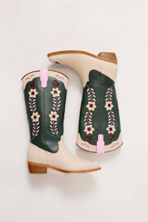 Pair of green cowboy boots with floral patterns on a white background