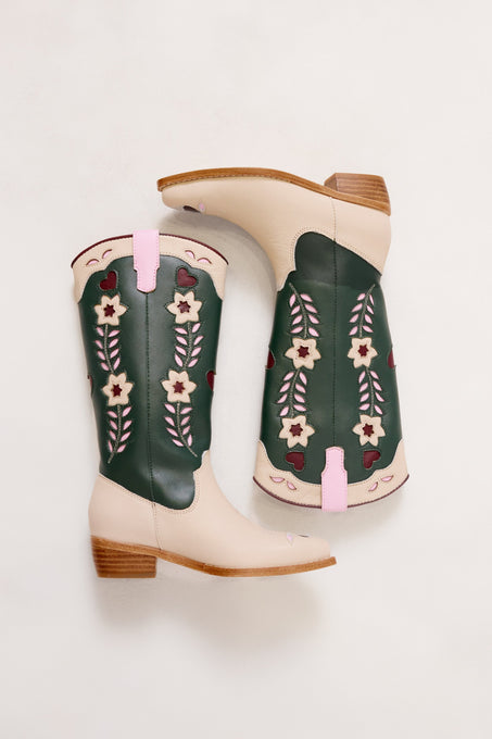 Pair of green cowboy boots with floral patterns on a white background