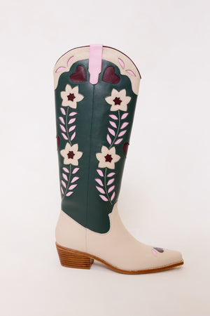 Green and white cowboy boot with floral design on a white background