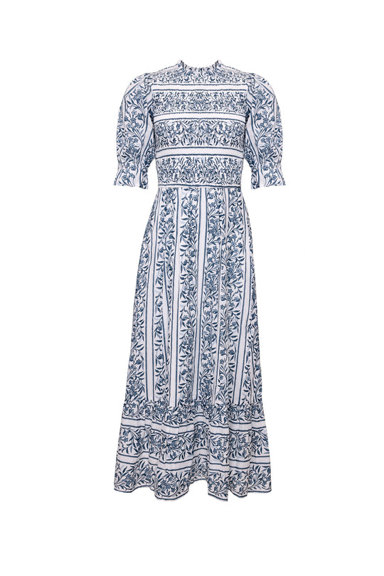 Blue and white patterned dress on a white background