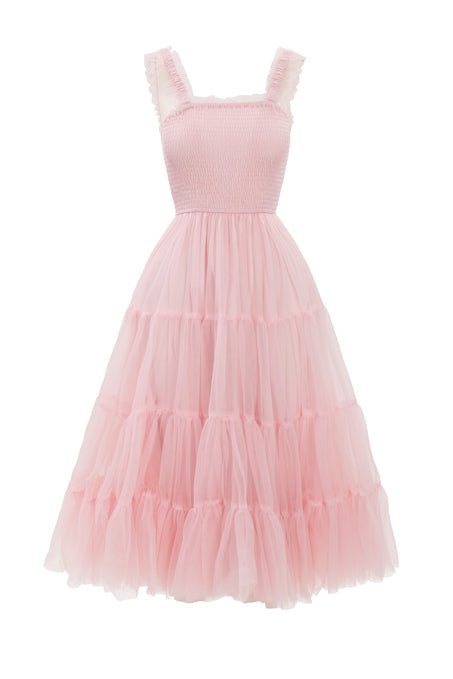 The Destiny Dress in Pink by Ivy City Co is a sleeveless, light pink tulle maternity dress with ruffled straps, a smocked bodice, and a full tiered skirt—offering comfort and romantic style for moms-to-be.