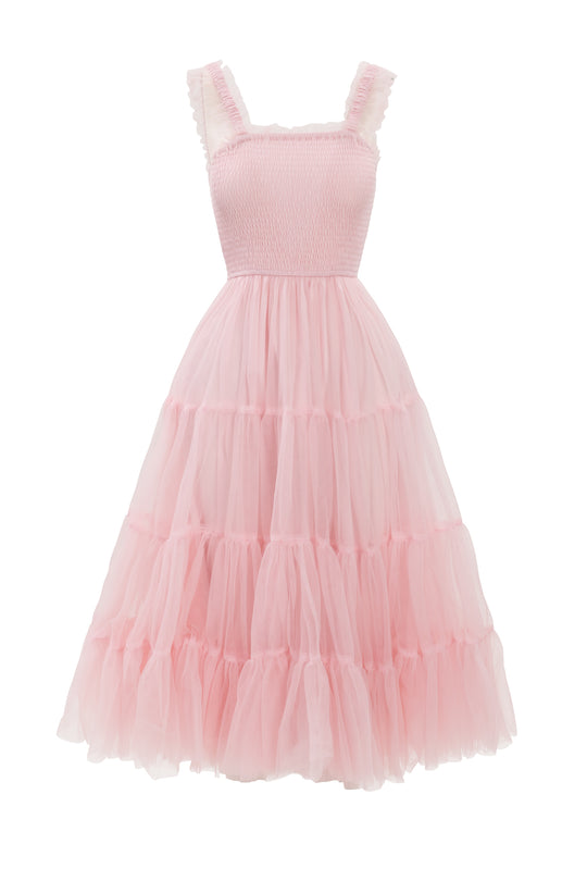 The Destiny Dress in Pink by Ivy City Co is a sleeveless, light pink tulle maternity dress with ruffled straps, a smocked bodice, and a full tiered skirt—offering comfort and romantic style for moms-to-be.