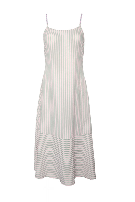 The Marbella Dress in Green & Pink Pinstripe by Ivy City Co features thin shoulder straps and vertical pastel stripes along its sleeveless, knee-length silhouette. A horizontal-striped bottom panel adds a subtle contrast, enhancing the effortlessly chic style of this midi dress.