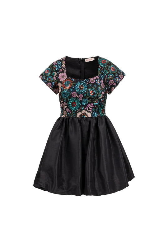 Black dress with floral top and black skirt on a white background