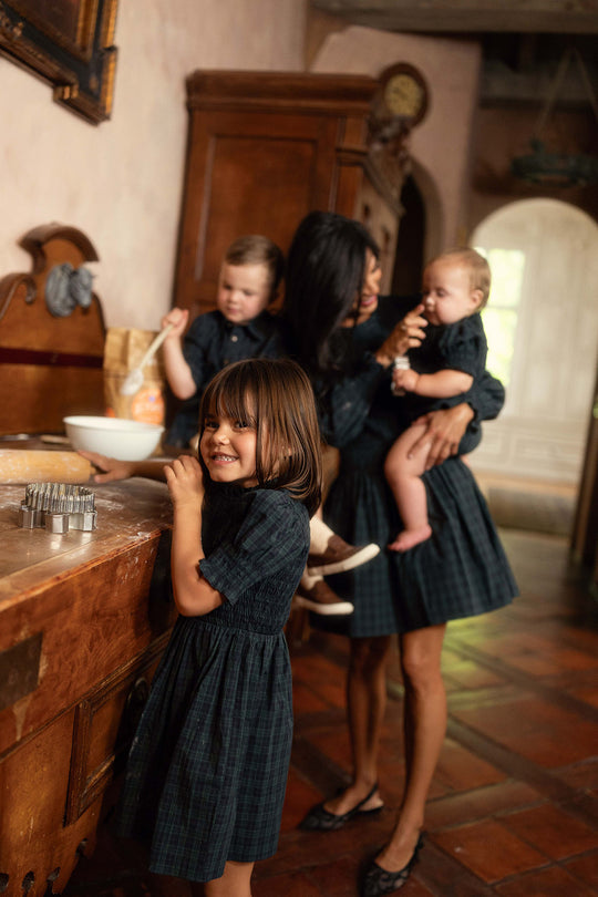 Mom and kids baking in a kitchen