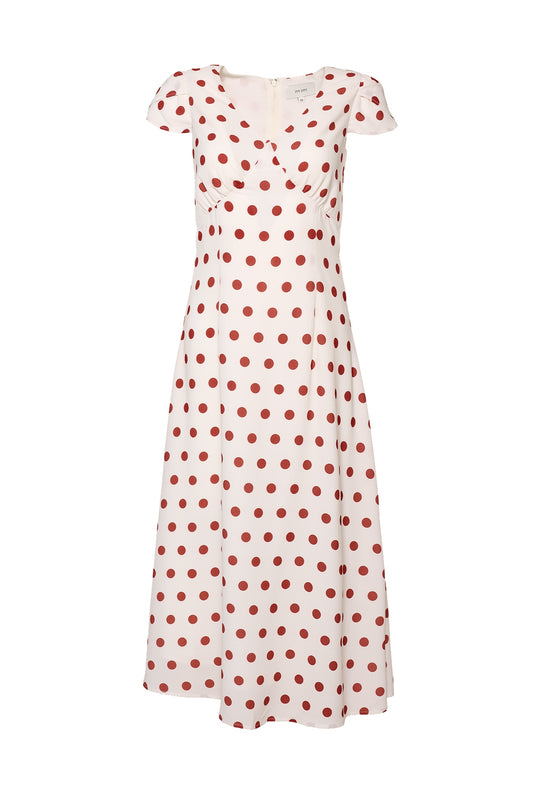 The Fiona Dress in Red Polka Dot by Ivy City Co features a white midi length, short sleeves, v-neckline, red polka dots, fitted bodice, and a slightly flared skirt—perfect for an effortlessly chic summer look.
