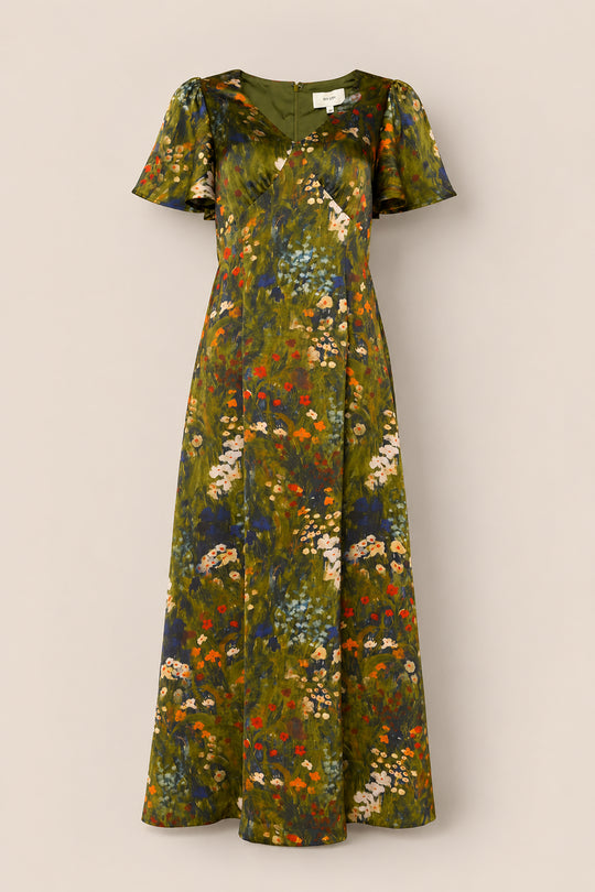 The Fiona Flutter-Sleeve Maxi Dress in Impressionist Bloom by Ivy City Co features a green satin fabric, short flutter sleeves, and a colorful floral pattern in shades of orange, white, and blue. It is displayed on a plain background.
