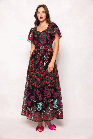 Woman wearing a floral dress on a white background
