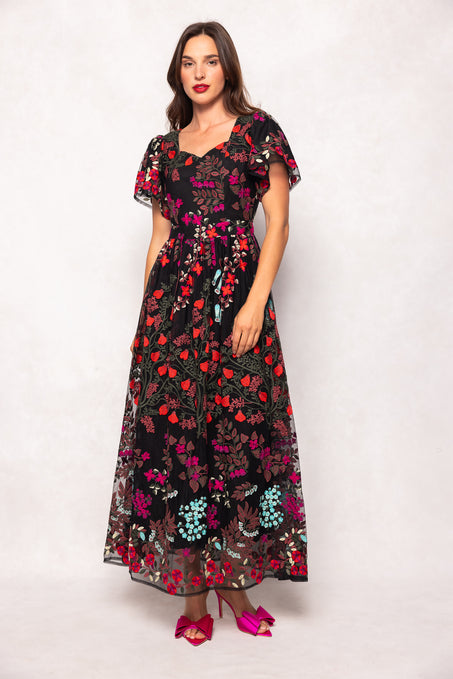 Woman wearing a floral dress on a white background