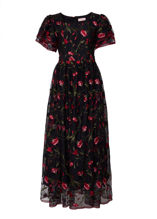 black floral dress against a white background