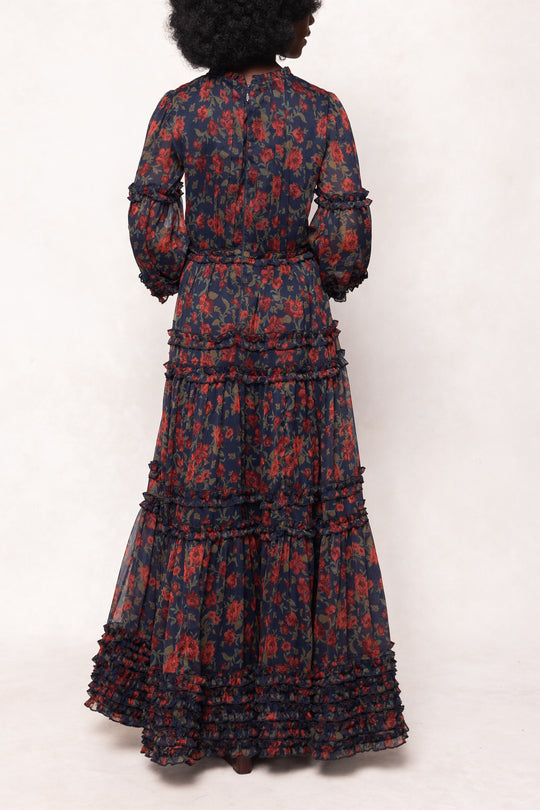 Long floral dress with a pattern of red and blue on a white background