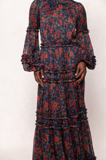 Long-sleeve dress with red floral pattern on a white background