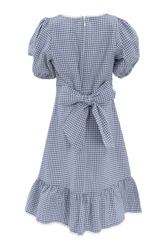 The Mini Hannah Dress in Blue Gingham by Ivy City Co features vintage charm with blue-and-white gingham, short puff sleeves, a back bow, and a ruffled hem for a timelessly feminine look.
