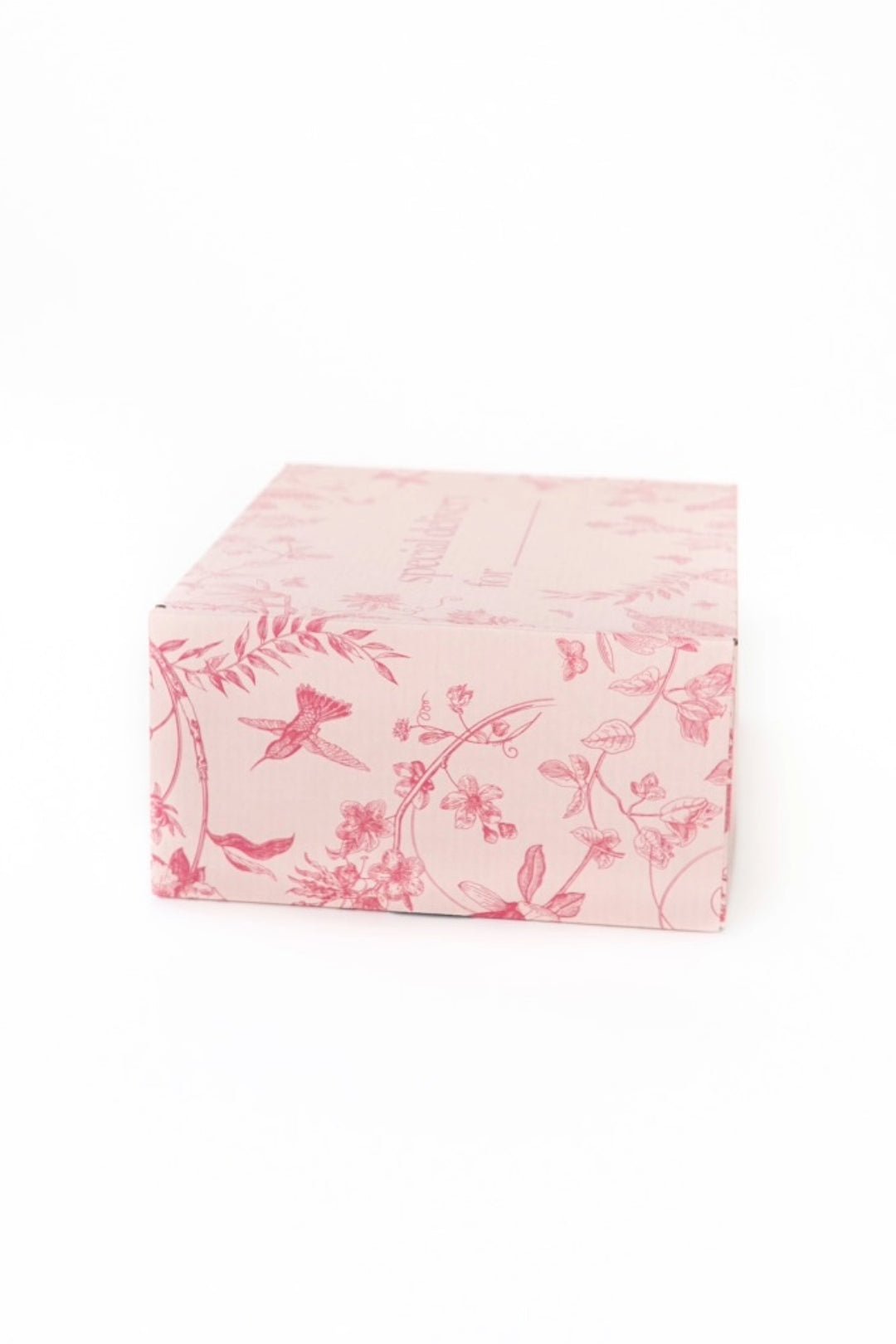 A light pink rectangular Gift Box from Ivy City Co, adorned with darker pink floral and bird patterns and set against a plain white background—this custom packaging makes for a thoughtful gift inspired by Ivy League elegance.