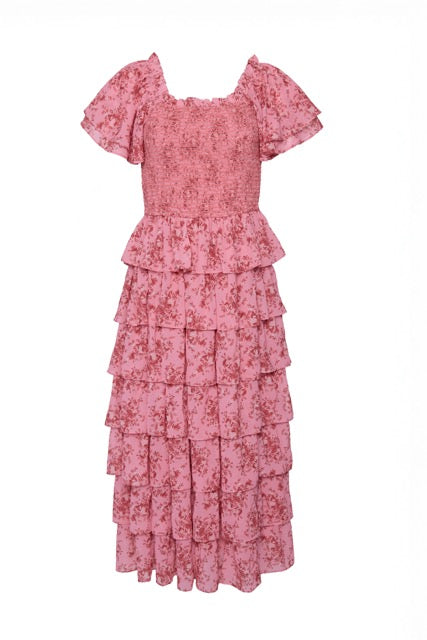 The Ivy City Co Grace Dress in Desert Heritage Rose features pink floral fabric, puff sleeves, a smocked bodice, and tiered ruffles. Maternity friendly and perfect for any occasion, it's showcased on a white background.