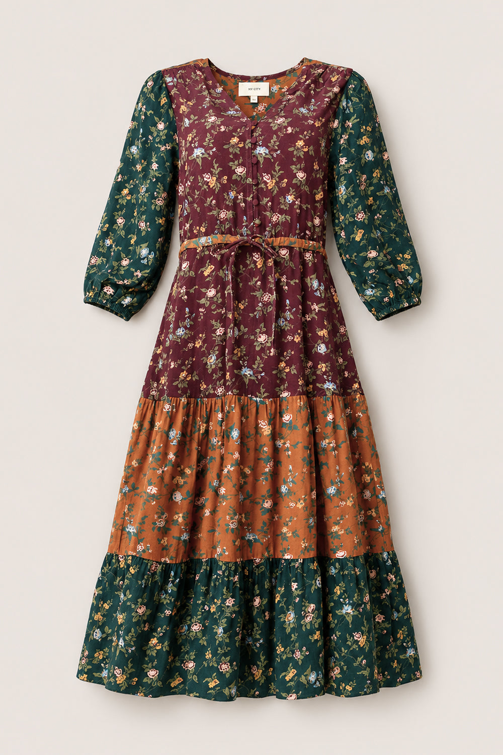 Introducing the Harlowe Dress in Elysian Vine by Ivy City Co: a long-sleeve, tiered maxi dress with elegant puff sleeves and a floral print in beautiful shades of burgundy, green, and rust-orange. Designed with a cinched tie waist and flowy silhouette, this stylish dress is also maternity friendly.