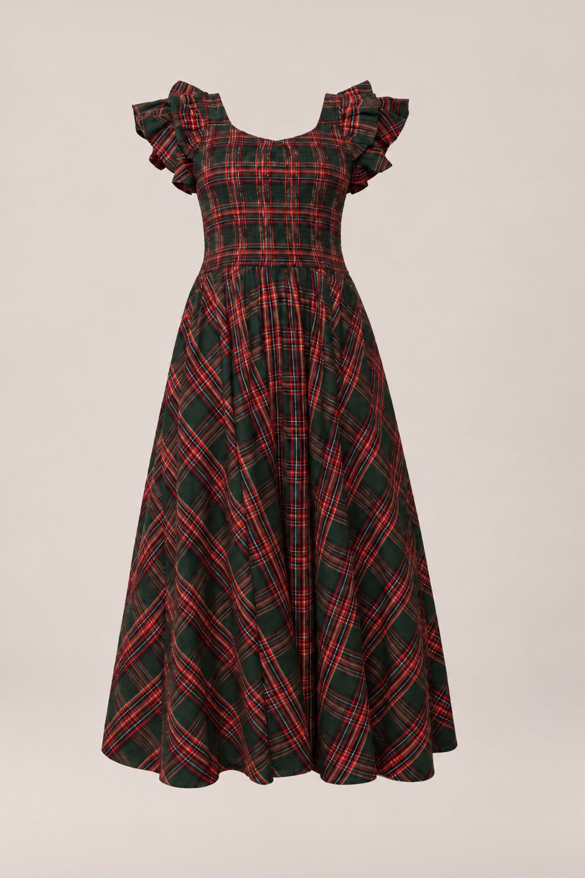 The Hattie Dress in Evergreen Plaid by Ivy City Co features a vintage-inspired red and green plaid pattern, short ruffled sleeves, a fitted bodice, and a flared ankle-length skirt. Maternity friendly and ideal as an enchanting holiday dress, it is displayed on a simple light background.
