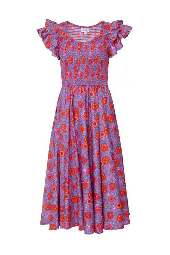 The Hattie Dress in Thistle Flower Poppy Woodblock by Ivy City Co features a vibrant floral print, smocked bodice, ruffled short sleeves, and a flowing midi skirt—maternity friendly and perfect for stylish comfort.