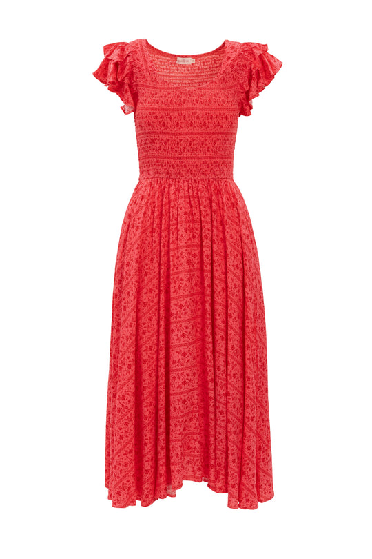 The Hattie Dress in Crimson Pink by Ivy City Co is a short-sleeve cotton midi with a fitted smocked bodice, ruffled sleeves, flared skirt, and subtle floral pattern.