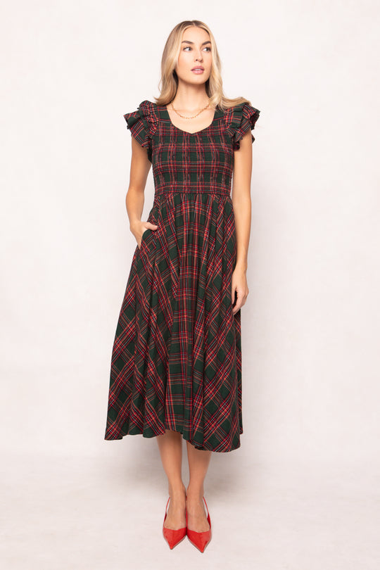 model in a evergreen plaid dress on a white back ground 