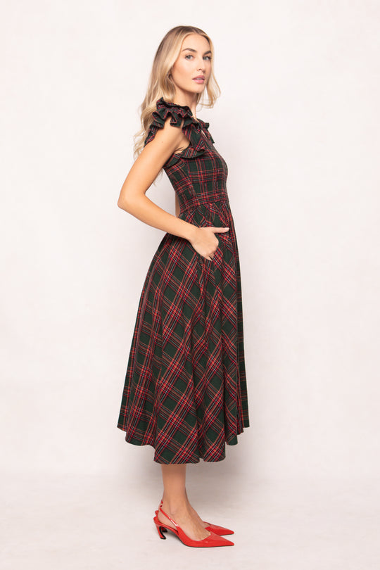 model in a evergreen plaid dress on a white back ground 