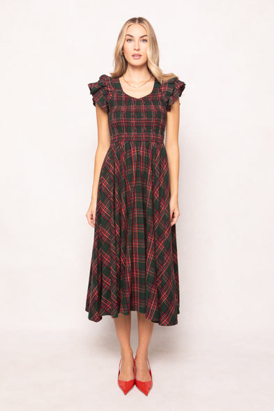 model in a evergreen plaid dress on a white back ground 