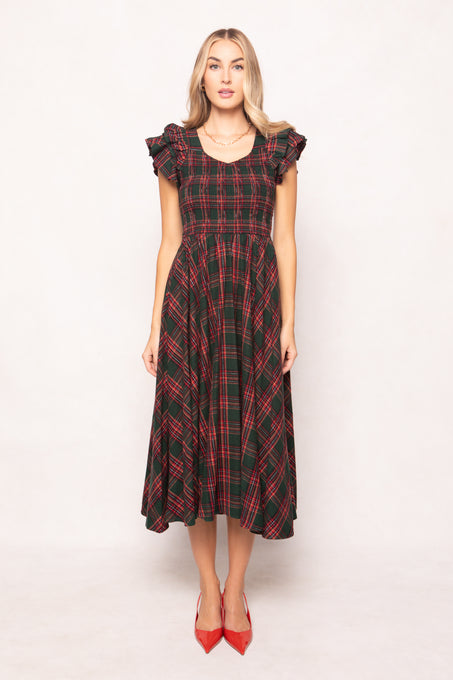 model in a evergreen plaid dress on a white back ground 