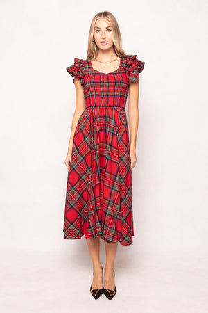 woman in red plaid dress on a white background