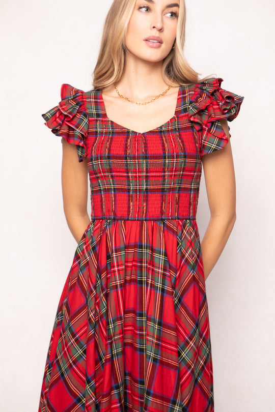woman in red plaid dress on a white background