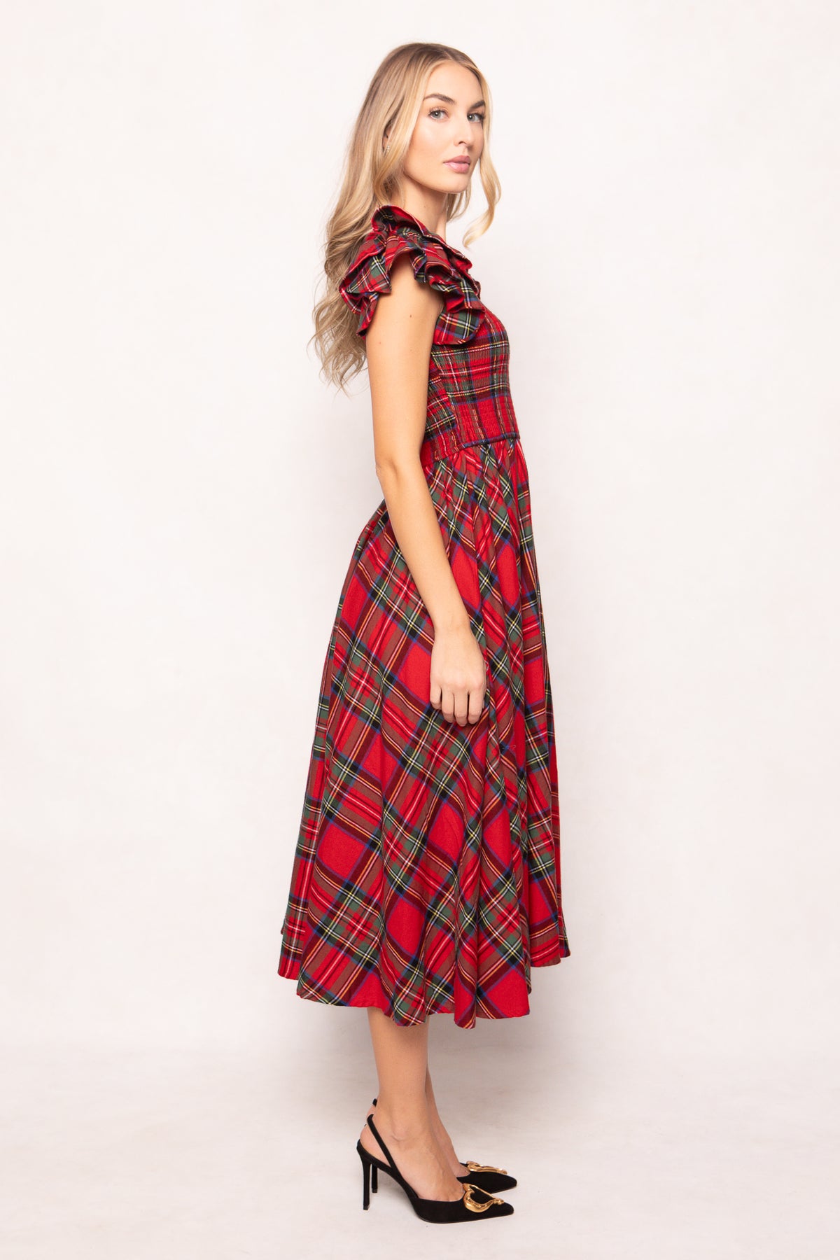 woman in red plaid dress on a white background