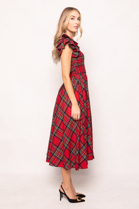 woman in red plaid dress on a white background