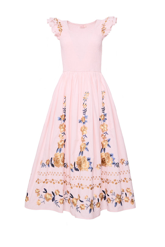 pink embroidered dress against a white background