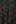 Close-up of fabric with red berry and green leaf pattern on black background