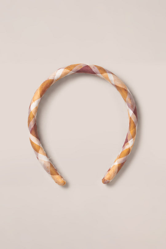 The Ivy City Co Hair Bows in Spiced Plaid, crafted from soft cotton and featuring a charming plaid pattern in shades of brown, tan, and white, are displayed on a plain light background to showcase their timeless style and comfortable design.