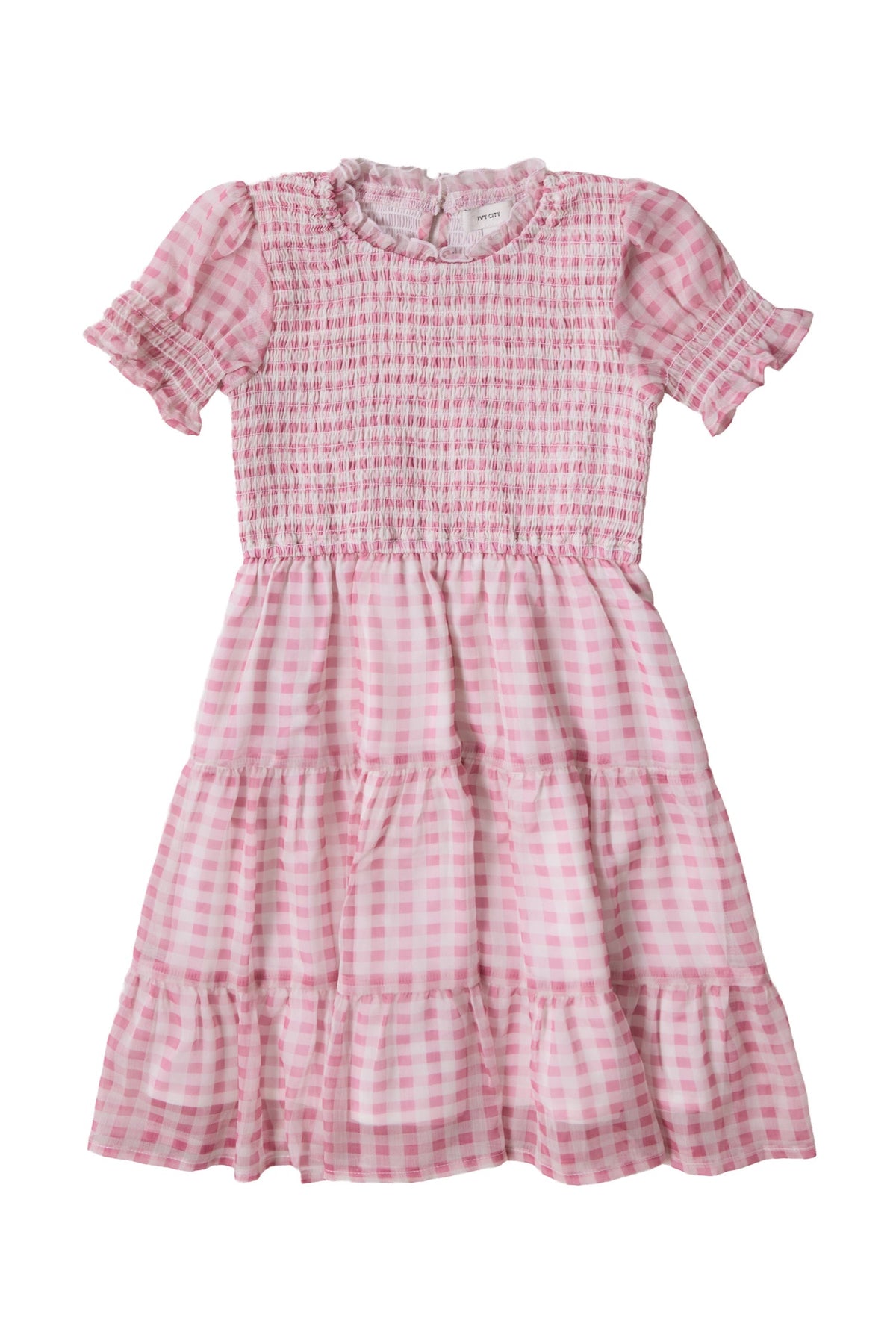 The Ivy City Co Mini Cordelia Dress in Desert Rose Gingham is a delightful girls’ spring dress, showcasing pink and white gingham fabric with short puffed sleeves, a smocked bodice, tiered skirt, and ruffled neckline, set against a white background.